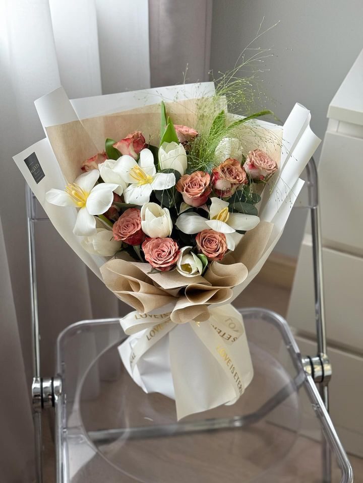 Lily and rose bouquet in kraft and cream wrapping